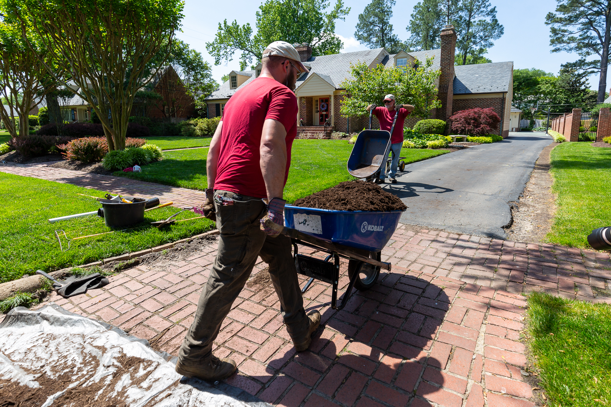 Mulch teamwork from the truck to the beds